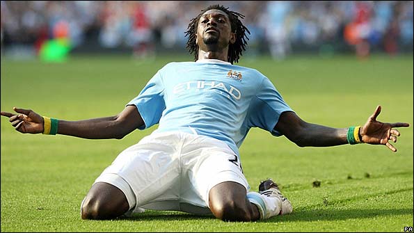 Emmanuel Adebayor celebrates in front of Arsenal fans
