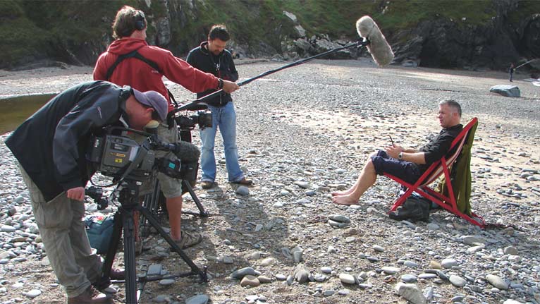 Derek sat in a deck chair
