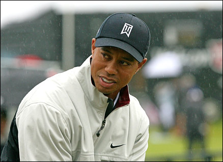 Tiger Woods practices in the rain at Carnoustie