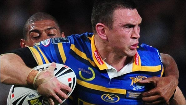 Sinfield tries to burst through Leon Pryce's tackle
