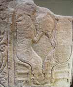 A carving of St Paul and St Antony breaking bread