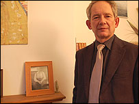 Caroline's partner Dave with a photo of his dad - also a miner