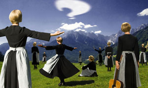 Many nuns on a mountain dressed as Maria