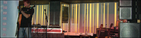 A man from City Showcase helps to set up the stage