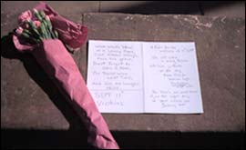 Tributes of flowers and letters left at Coventry Cathedral 