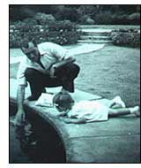 Sue and dad by a pond