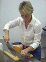 Jo cutting the cheese