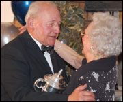 Sid's sister presents Bernie Perrier with his cup