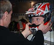 Luke tries his helmet for size