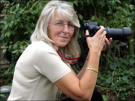 Christine Button holding her camera