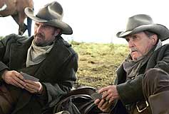 Charley Waite (Kevin Costner) and Boss Spearman (Robert Duvall) playing cards in 'Open Range'