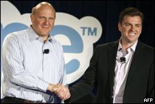 Microsoft CEO Steve Ballmer (L) shakes hands with Skype CEO Tony Bates