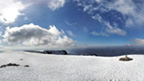 View from the snow-covered top of Ben Nevis.