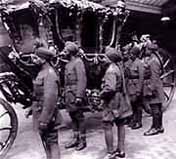 Photo of Indian officers examining the State Coach of the King-Emperor