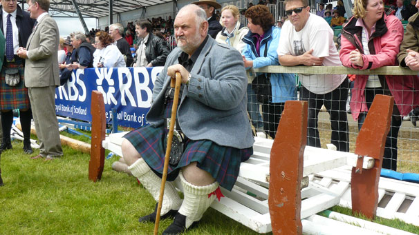 Dr Douglas Edmunds takes a seat while waiting for the Highland games action to take place in the main ring. Edmunds is a former World Professional Caber Tossing Champion.