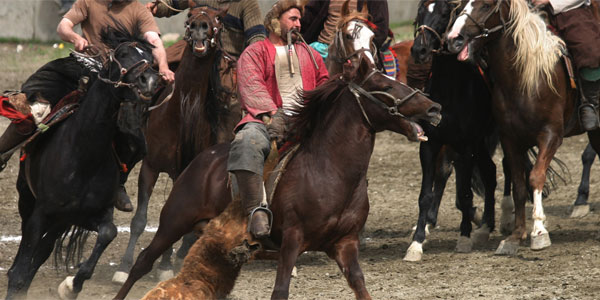 Men on horses take part in Bozkashi