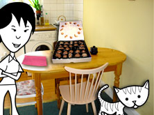 Helen and the cat in the kitchen with a box of chocolates