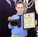 Matthew Hallam with his award