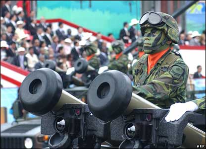 Taiwanese soldiers in camouflage uniforms and using US-made Javelin anti-tank missiles stand atop of an army vehicle in national day celebrations in Taipei.