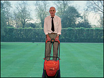 Man with lawnmower