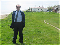 Philip Key with the beachside caravans