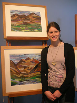 Josie Russell with some of her art work. Image courtesy of The National Trust