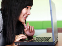 A woman using a laptop