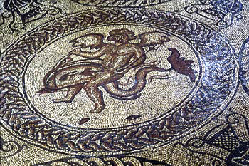 Cupid astride dolphin