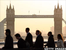 City workers walking past Tower Bridge in London