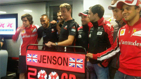 Fernando Alonso, Lewis Hamilton, Pedro de la Rosa, Jenson Button, Timo Glock, Jerome d'Ambrosio, Paul di Resta (hidden), Sergio Perez and Felipe Massa at Jenson Button's 200th grand prix celebration