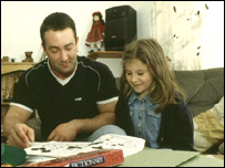 Father and daughter playing a board game