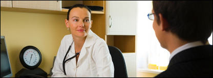 A doctor seeing a patient