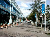 Brayford Pool front with water clock on the right and information board on the left.