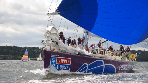 Crew of Edinburgh Inspiring Capital preparing the sails