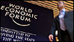 A participant enters the Davos Congress Centre on the opening day of the World Economic Forum