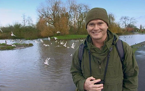 Simon King by a river