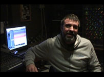 Neil Bassett sat in a recording studio