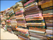 Stacks of mattresses provided for artists and members of the press to drag into their bedouin accommodation at the festival