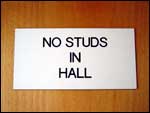 "No studs in Hall" sign