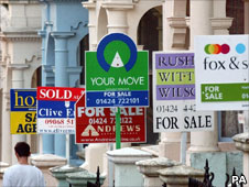 Houses with for sale signs