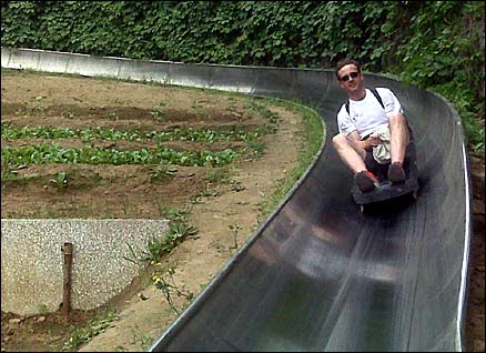 Steve Smith takes a toboggan ride near the Great Wall of China