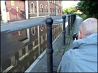 Simon Brown lines up a photograph