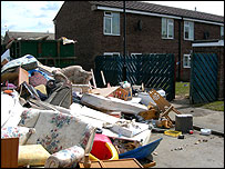 Contents of houses outside after floods, June 2007