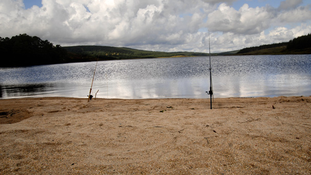 Two fishing rods on beach