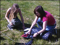 Katy and Chloe set up the tents