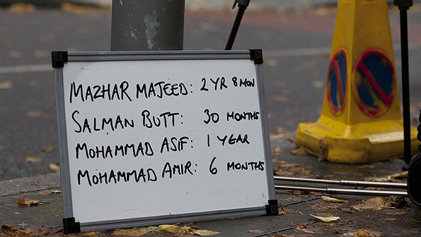 A board outside Southwark Crown Court lists the Pakistan players' sentences