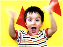 A child laughing and clapping