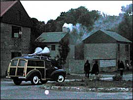 Smoke from the chimney of the renovated house
