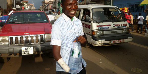 Japaty Mambu, pictured here aged 16, says his scar means he will never forget Sierra Leone's civil war