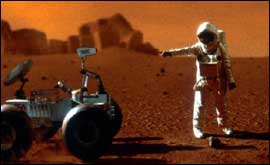 Mock up of astronaut next to a space vehicle